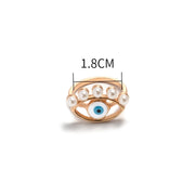 dimensions bague mauvais oeil dorée avec des perles 